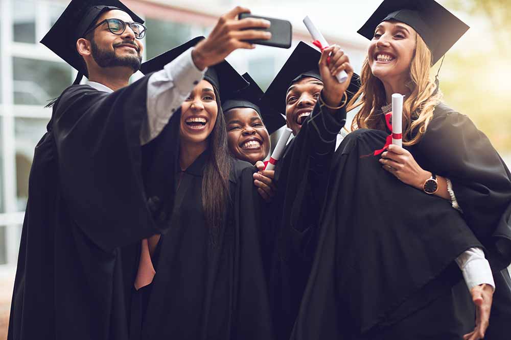 University graduates taking a selfie